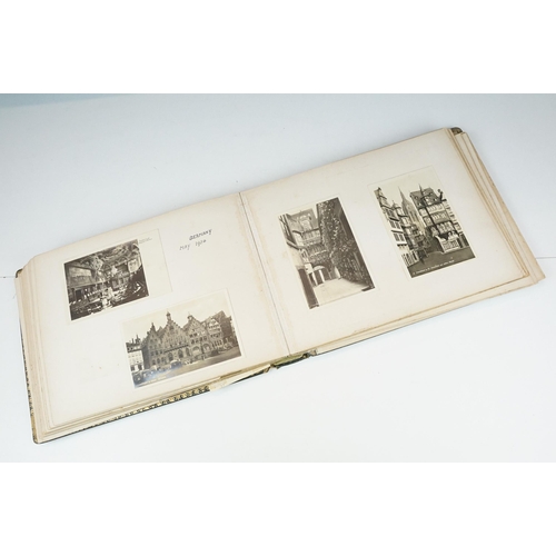 310 - Early 20th century black leather album containing approximately 250 black and white photographs and ... 