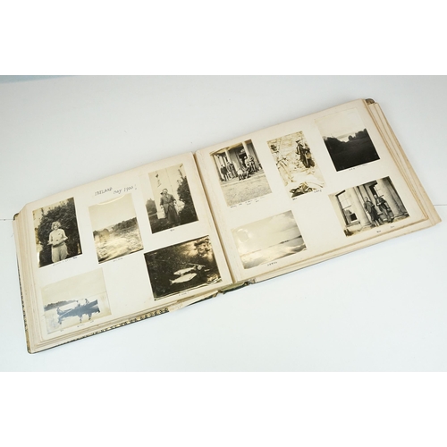 310 - Early 20th century black leather album containing approximately 250 black and white photographs and ... 