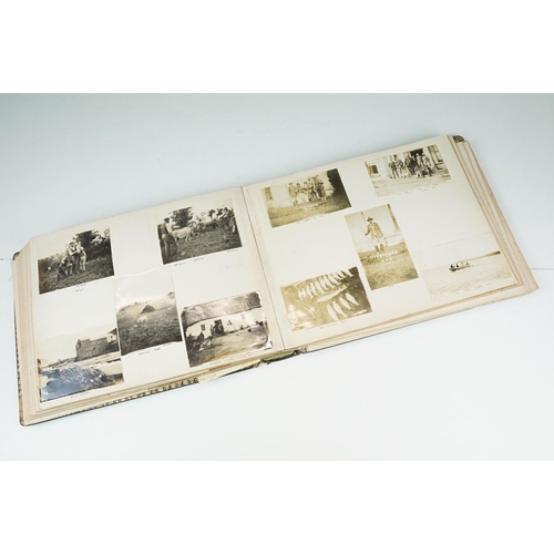 310 - Early 20th century black leather album containing approximately 250 black and white photographs and ... 