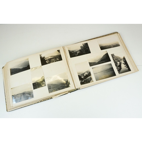 310 - Early 20th century black leather album containing approximately 250 black and white photographs and ... 