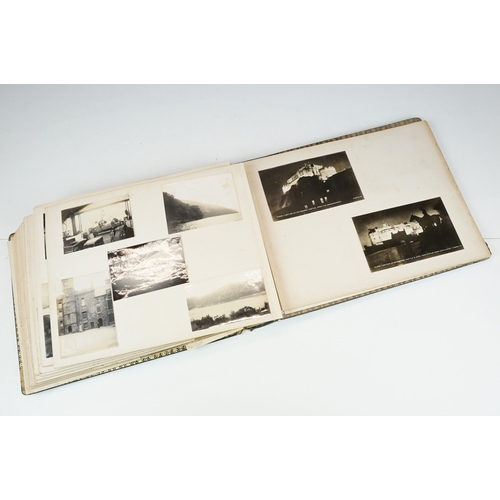 310 - Early 20th century black leather album containing approximately 250 black and white photographs and ... 