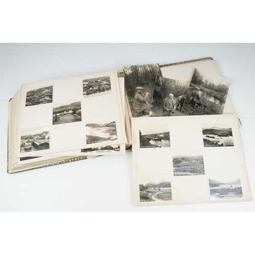 310 - Early 20th century black leather album containing approximately 250 black and white photographs and ... 