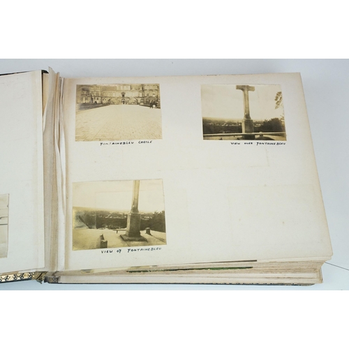 310 - Early 20th century black leather album containing approximately 250 black and white photographs and ... 