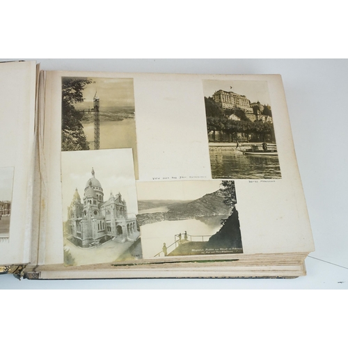 310 - Early 20th century black leather album containing approximately 250 black and white photographs and ... 