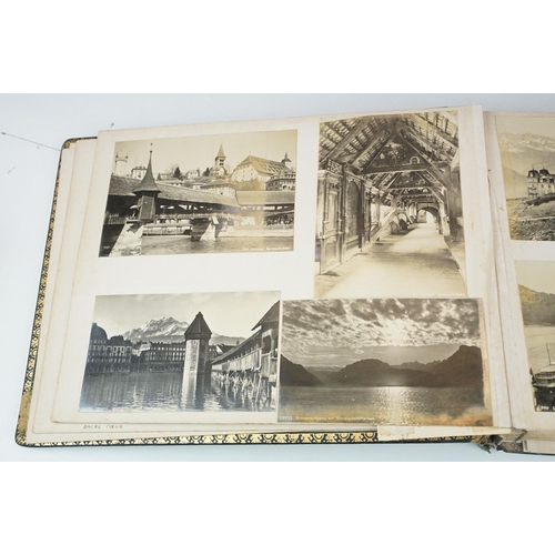 310 - Early 20th century black leather album containing approximately 250 black and white photographs and ... 