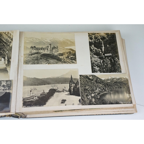 310 - Early 20th century black leather album containing approximately 250 black and white photographs and ... 