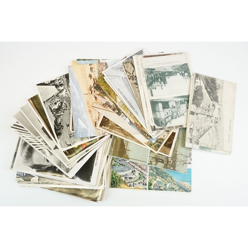 312 - A collection of mainly early 20th century printed and real photo postcards to include topographical ... 