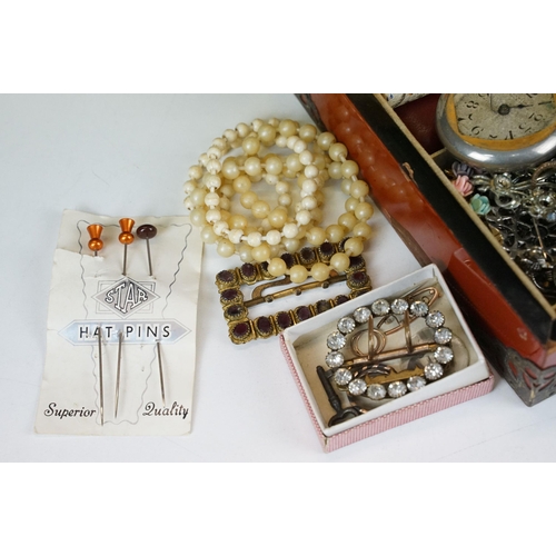 313 - A collection of vintage costume jewellery to include 9ct gold and sterling silver brooches, sovereig... 