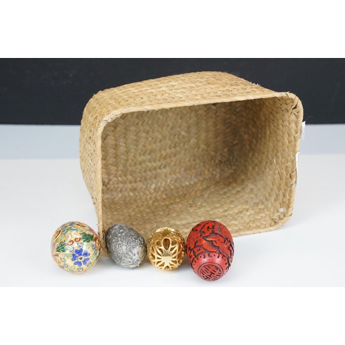 316 - A collection of four contemporary collectable egg ornaments to include a cloisonne example.