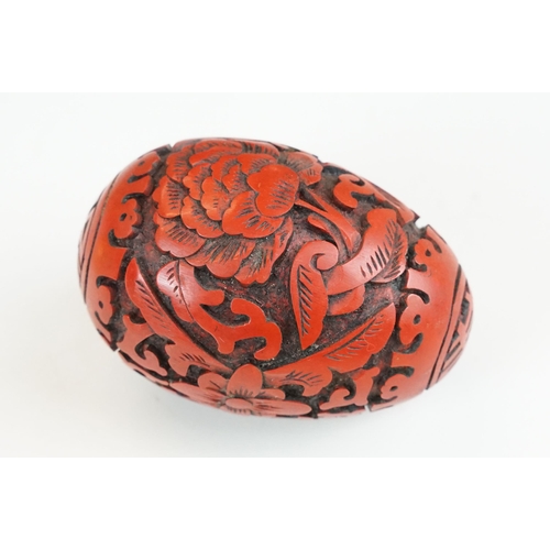 316 - A collection of four contemporary collectable egg ornaments to include a cloisonne example.