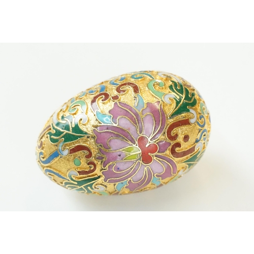 316 - A collection of four contemporary collectable egg ornaments to include a cloisonne example.