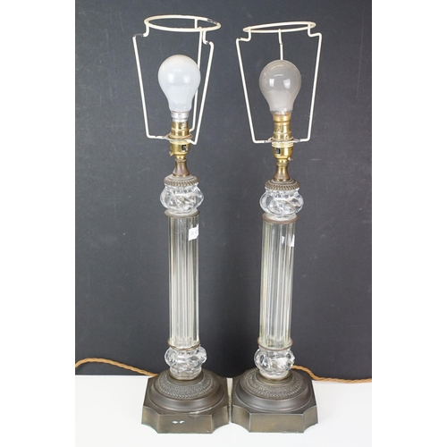 326 - 20th century pair of glass columnar lamp bases with bronze effect bases, H 47cm