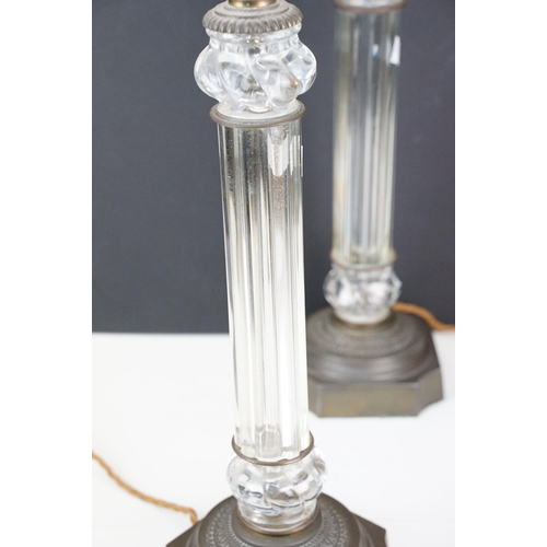 326 - 20th century pair of glass columnar lamp bases with bronze effect bases, H 47cm