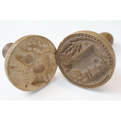 377 - Two antique butter stamps of cow print and thistle carvings, together with a cylindrical lidded 'Joh... 