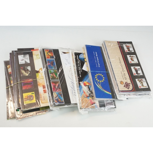 346 - A large collection of British Royal Mail presentation packs within three albums together with loose ... 