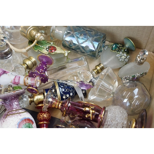 122 - Large quantity of perfume and scent bottles in varying forms and finishes