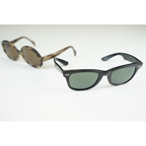 264 - Two pairs of vintage sunglasses to include Rayban and Metzler examples.