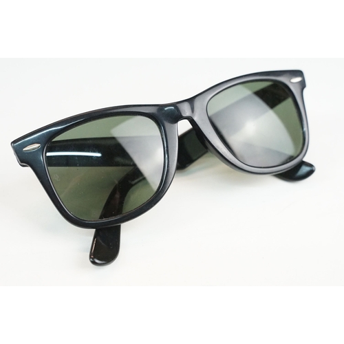 264 - Two pairs of vintage sunglasses to include Rayban and Metzler examples.