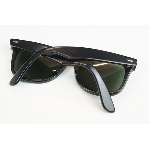 264 - Two pairs of vintage sunglasses to include Rayban and Metzler examples.