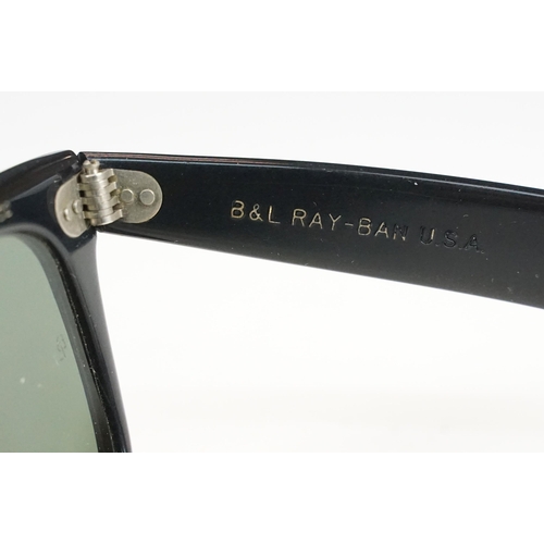 264 - Two pairs of vintage sunglasses to include Rayban and Metzler examples.