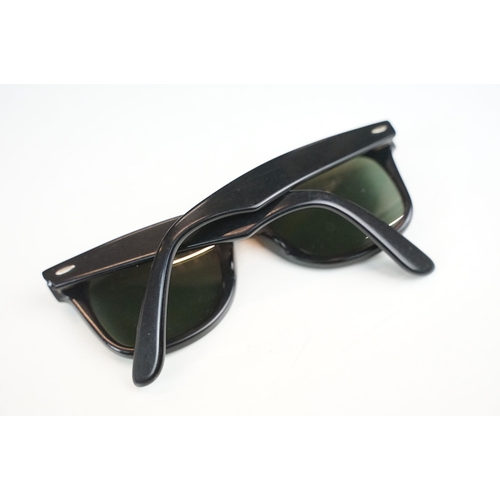 264 - Two pairs of vintage sunglasses to include Rayban and Metzler examples.