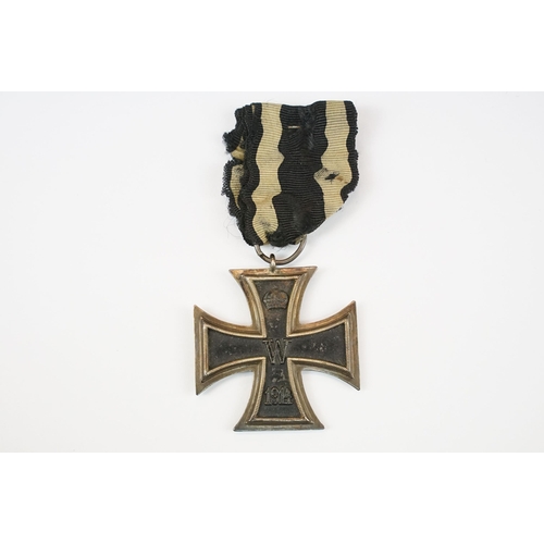 266 - A World War One German full size Iron Cross 2nd class medal with original ribbon.