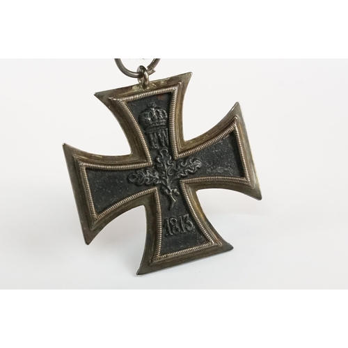 266 - A World War One German full size Iron Cross 2nd class medal with original ribbon.