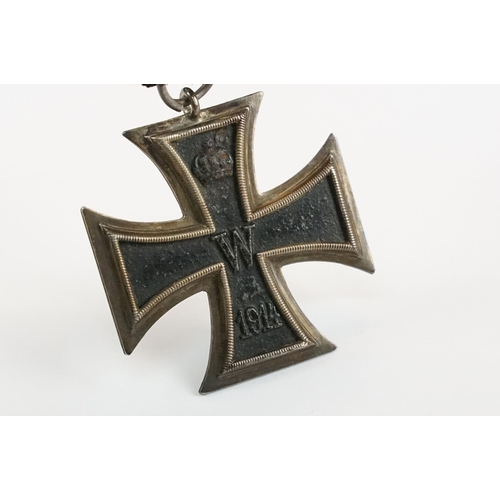 266 - A World War One German full size Iron Cross 2nd class medal with original ribbon.