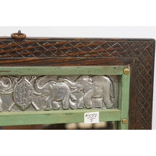 557 - Vintage carved wooden wall mirror with white metal plaques depicting elephants and hippos, 53 x 36.5... 