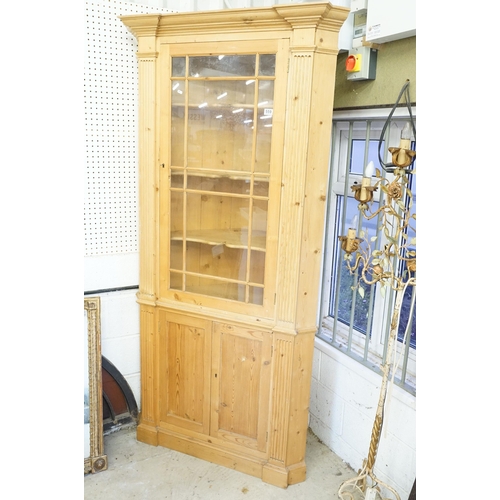 559 - 20th century pine corner cupboard, with breakfront pediment, astragal glazed door opening to reveal ... 