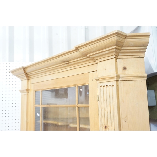 559 - 20th century pine corner cupboard, with breakfront pediment, astragal glazed door opening to reveal ... 