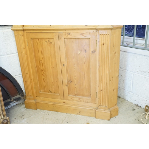 559 - 20th century pine corner cupboard, with breakfront pediment, astragal glazed door opening to reveal ... 