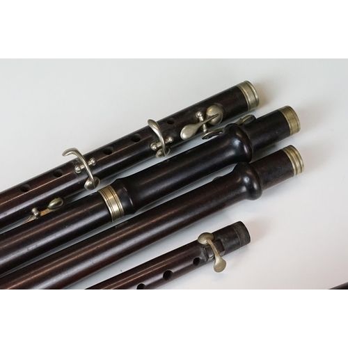 382 - A collection of various woodwind instrument (Possibly Piccolo) parts by J. Wallice & Sons of London.