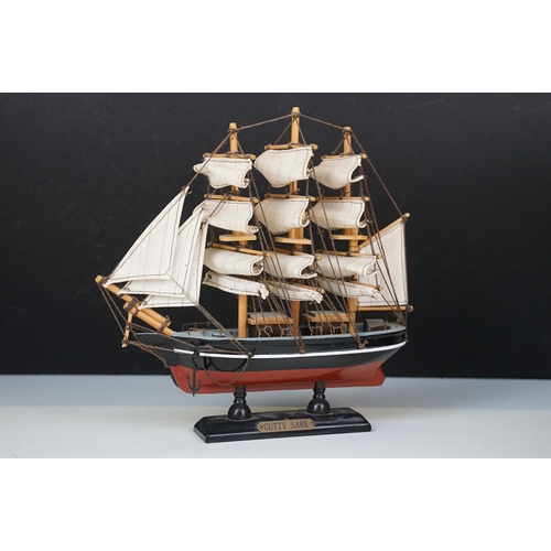 394 - Six kit built model boats to include three sailing boats and two fishing boats.