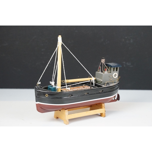 394 - Six kit built model boats to include three sailing boats and two fishing boats.