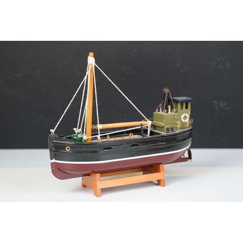 394 - Six kit built model boats to include three sailing boats and two fishing boats.