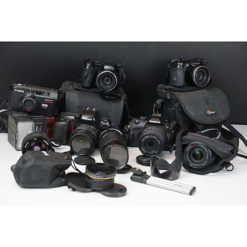 400 - Collection of cameras and related equipment to include Nikon F50, Olympus E-420, a zuiko digital 14-... 