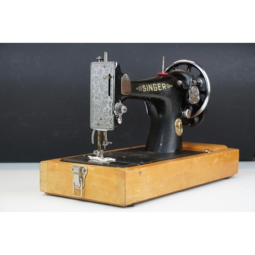 403 - Early 20th Century singer sewing machine set within wooden case together with a later Singer example... 