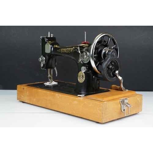 403 - Early 20th Century singer sewing machine set within wooden case together with a later Singer example... 