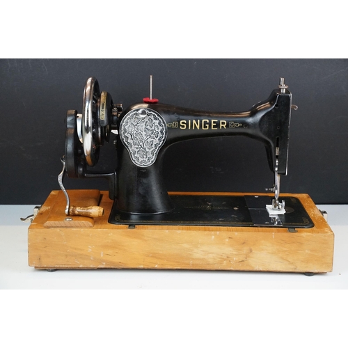 403 - Early 20th Century singer sewing machine set within wooden case together with a later Singer example... 