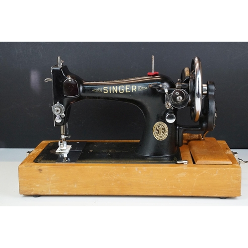 403 - Early 20th Century singer sewing machine set within wooden case together with a later Singer example... 