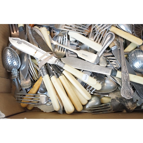 405 - A collection of mixed cutlery to include butter knives, fish knives and many silver plated examples.