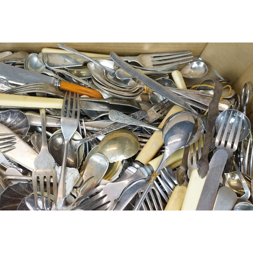 405 - A collection of mixed cutlery to include butter knives, fish knives and many silver plated examples.