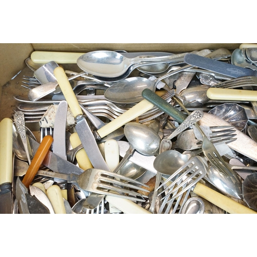 405 - A collection of mixed cutlery to include butter knives, fish knives and many silver plated examples.