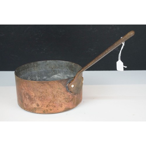 306 - A set of graduated copper saucepans together with three copper graduated pans.