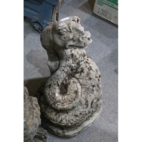 543 - Three cast garden statues in the form of dragons. Largest measures 54cm.