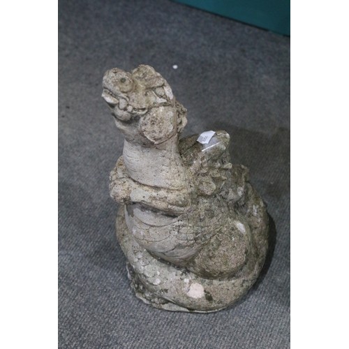 543 - Three cast garden statues in the form of dragons. Largest measures 54cm.