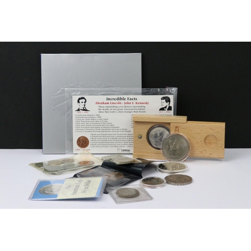 156 - A small collection of mixed coins to include a 1999 Liberty Dollar and a Royal Mint Millenium commem... 