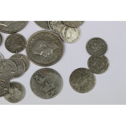 199 - A small collection of British pre decimal silver coins to include double florin, florins, shillings,... 