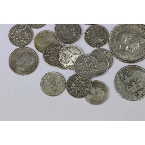 199 - A small collection of British pre decimal silver coins to include double florin, florins, shillings,... 